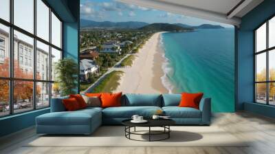 Aerial view of a pristine beach with turquoise water and coastal houses
 Wall mural