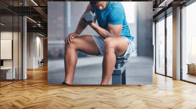 Dumbbells, gym and man fitness training as a healthy bodybuilder for strong biceps or powerful arm muscles. Workout, exercise and sports athlete weight lifting heavy weights for strength in Dubai Wall mural