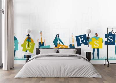 Group of young business people working with puzzles and making Success sign as symbol of collaborating, solving problems, thinking about creative idea, brainstorming and teamwork concept.  Wall mural