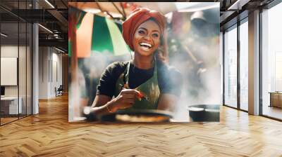 Happy attractive African woman cooking food on street market and smile to camera. Travel, food, holidays concept  Wall mural