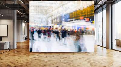 Multiple exposure image of lots of people walking and waiting for boarding in the Waterloo train station. Commuting rush hours concept, modern life.  Wall mural