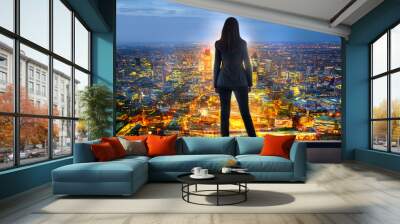 Young woman looking over the City of London  Wall mural