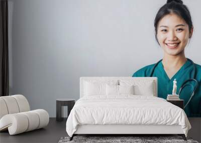 Smiling Female Doctor in Green Scrubs Wall mural