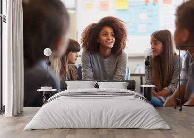 Group of young people sitting in a circle in a classroom Wall mural