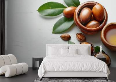 A heap of nutritious vegan argan nuts in a little wooden bowl. Wall mural