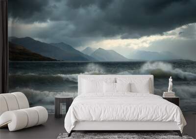 A stormy sea with large waves crashing against the shore. The sky is dark and cloudy, creating a moody and dramatic atmosphere Wall mural