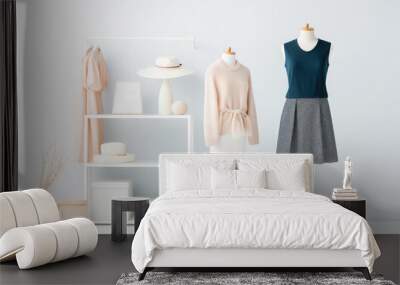 A stylish wardrobe room with a variety of fashionable clothes on racks and shelves. Wall mural