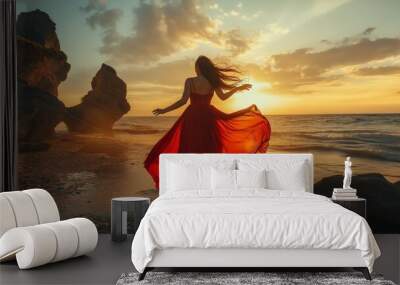 A woman in a red dress is dancing on the beach at sunset. The scene is serene and peaceful, with the woman's movements and the setting sun creating a sense of freedom and joy Wall mural