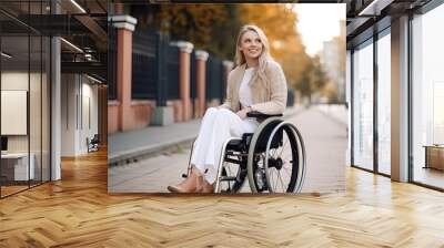 A young woman with a beaming smile in a wheelchair. Wall mural