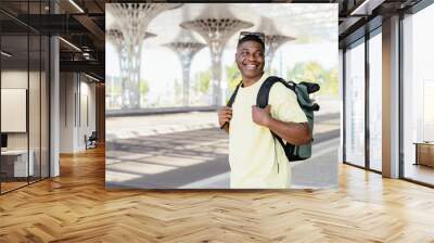 African man spending time outdoors. Wall mural