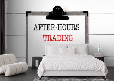 AFTER-HOURS TRADING text on clipboard on white background Wall mural