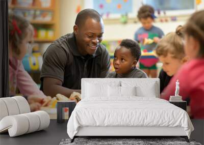 An African kindergarten teacher smiles while children play and learn in a colorful classroom. Wall mural