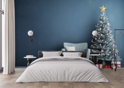 Beautiful Christmas tree with gifts near chair and dusty blue textured wall. Monochrome empty living room Wall scene mockup. Promotion background. Wall mural