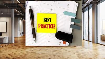 BEST PRACTICES word on the yellow sticky with office tools on daily planner Wall mural