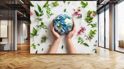 close up Hands holding earth globe, leaves and flowers on background, space for text, earth day Wall mural