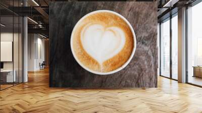 close up of fresh delicious cappuccino coffee with beautiful latte art in the shape of heart on dark Wall mural