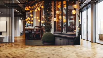 Empty and beautifully lit outdoor restaurant terrace in the evening with lights and Christmas decor, with antique wooden furniture creating a warm and cozy atmosphere for diners. Wall mural