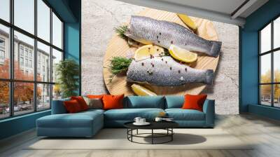 Fresh raw sea bass with dill, lemons and spices on marble kitchen table prepared for cooking. Healthy and organic seafood concept. Wall mural