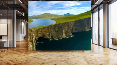 Landscape panorama Sorvagsvatn lake on cliffs of Vagar island, Faroe Islands, Denmark. Lake above the ocean. a lake on the edge of an abyss. Hiking and travel concept. Wall mural