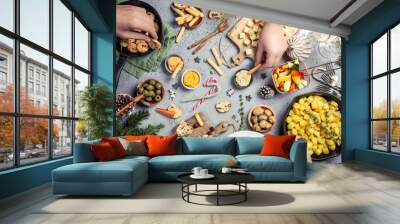 Festive flat lay with christmas dinner party table and human hands, holiday vegeterian food concept background, top view Wall mural