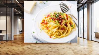 Italian pasta spaghetti Carbonara with fried bacon, parmesan cheese and parsley on white plate. Restaurant food concept. Wall mural