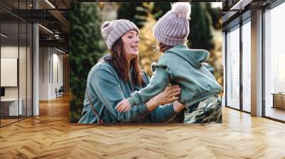 mother and daughter hugging together in autumn park   Wall mural