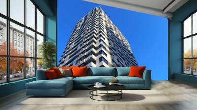 new modern building on background of blue sky, beautiful new apartment building  Wall mural