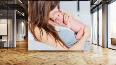 newborn baby and mother. Wall mural