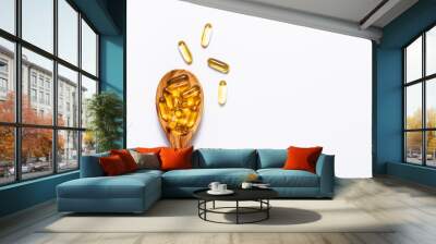 Omega 3 cod liver oil capsules in the wooden spoon on white background with copy space for your design. immunity support capsules. Health care concept. Wall mural