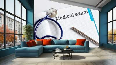 Paper with text MEDICAL EXAM on a table with stethoscope Wall mural