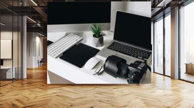 Photographer work desk with camera, laptop, tablet and computer Wall mural