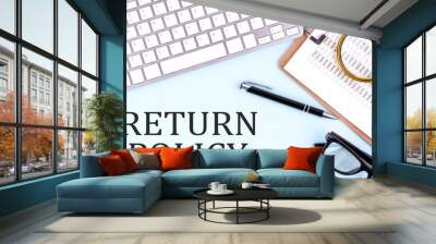 RETURN POLICY text on blue background with keyboard and clipboard, business concept Wall mural