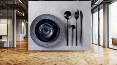 Set of porcelain handcraft  grey and black plates and  bowls cutlery set, linen napkin on a white wooden table. Flat lay Wall mural