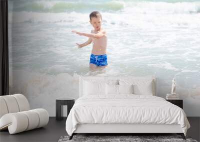 little boy and the sea waves Wall mural