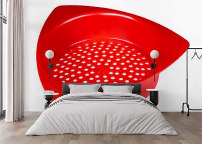 Small red plastic colander. Colander front view of modern plastic strainer isolated on white Wall mural