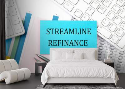 STREAMLINE REFINANCE text on blue sticker on chart with calculator and keyboard,Business concept Wall mural