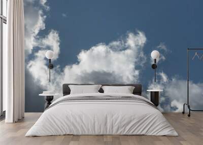 Cumulus clouds on a blue sky background Wall mural