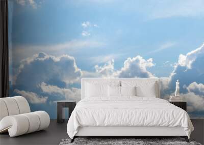 White curly clouds illuminated by the bright sun Wall mural