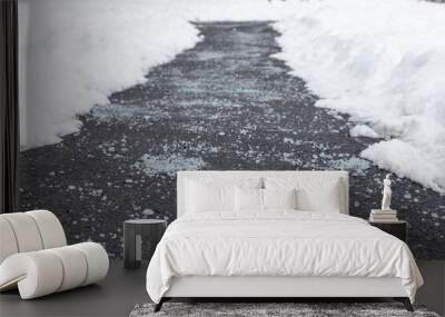 Winter road with salt for melting snow Wall mural