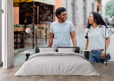 Young African American Couple Walking In The City Center Wall mural