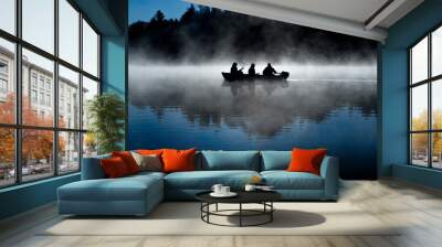 silhouette of fisherman on misty blue lake Wall mural