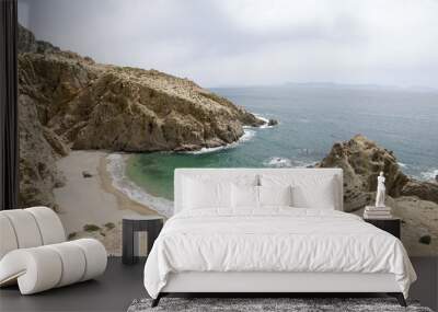 Small rocky bay with fine sand on the island of Samothraki in Greece Wall mural