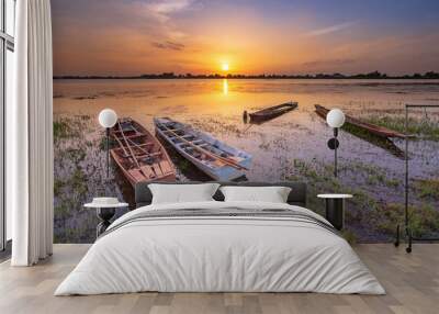 Beautiful view of fishing boats parked in reservoir with during sunset, In the northeast of Thailand Wall mural