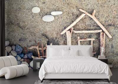 image of a little house from wooden sticks on the sea pebble beach. sea tour. concept image house. c Wall mural