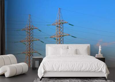 electric power transmission towers at sunrise Wall mural