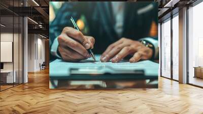 Close up hands of businessman in a suit signing a document at the desk in office Wall mural