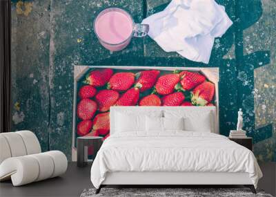  Box of strawberries on a rustic table in the field with a strawberry smoothie Wall mural