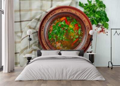 Close up view Chorba soup or stew with beef, herbs and hot pepper in brown bowl on wooden background, Traditional turkish cuisine Wall mural