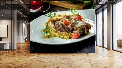 Close up view on Stewed Osso Buco steak with tomatoes, mashed potatoes served in a white plate on a dark marble background. Italian steak. Restaurant food Wall mural