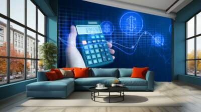 businessman hand holding calculator of digital banking investment financial and payment money concept on black background Wall mural